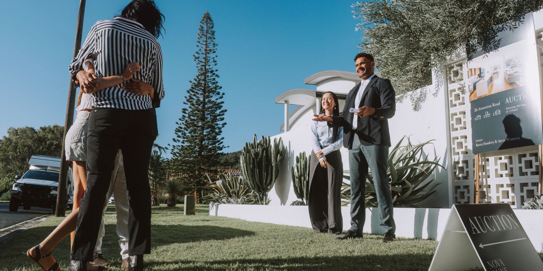 Buyers outside an Australian home at an auction